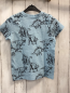 Preview: Nutmeg  T-Shirt  Gr. 128  hellblau schwarze Dinos 