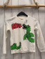Preview:   Langarmshirt  Gr. 122  weiß grüner Drache rote Schrift 