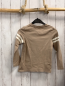 Preview:   Langarmshirt  Gr. 122  beige Krododil Schrift weiße Streifen am Ärmel 