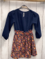 Preview: Tisfaja  Kleid  Gr. 110  blaues Oberteil grauer Rck mit buntem Ornamntdruck 