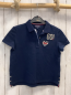 Preview: Tommy Hilfiger Poloshirt  Gr. 110  blau Aufnäher Schrift 