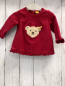 Preview: Steiff  Pullover  Gr. 56  rosa Rüschensaum Bärenkopf auf der Rückseite geknöpft 