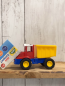 Preview: neu  Plastikspielzeug kleiner  rot gelb blauer Kipper 