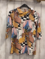 Preview:   Kleid  Gr. 104  weiß Hunde Gebäude schwarz weiße Karos 