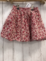 Preview:   Rock Gr. 122  creme rote Blumen mit grauem Rand 
