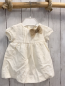 Preview: zara Kleid Gr. 68  weiß Struktur beige Schleife