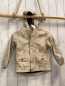 Preview:   Regenjacke  Gr. 110  beige gummiert Hunde auf Skateboards