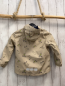 Preview:   Regenjacke  Gr. 110  beige gummiert Hunde auf Skateboards