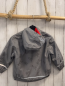 Preview:   Regenjacke  Gr. 92  hellgrau gummiert graue Dinos rotes Fleecefutter 