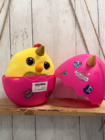 Rainbocorons Plüschspielzeug gelbes Einhorntier mit Glitzer in pink Plastikei