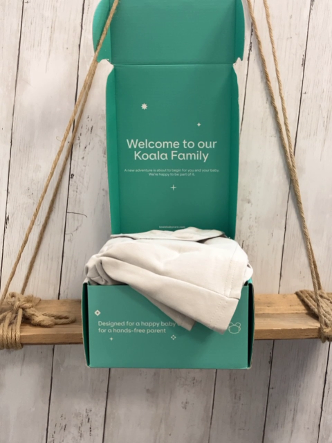 Koala  Babytragetuch  Koala Cuddle band 2 hellgrau schwarzer Stoff 